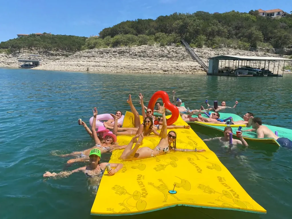 bachelor and bachelorettes floating on two different lily pads in devils cove