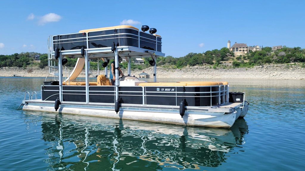 19 passenger 31ft Skyfall luxury tritoon with slide on Lake Travis