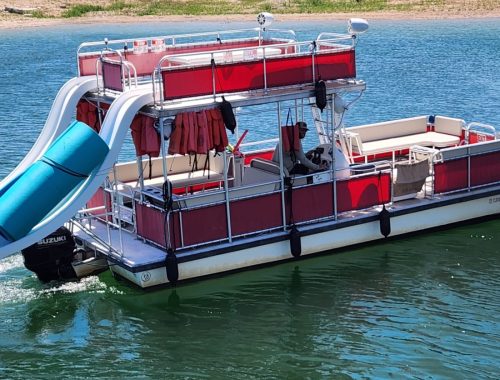 Islander Double Deck Party Boat Rental with slide, holds 19 passengers and is shown on lake travis