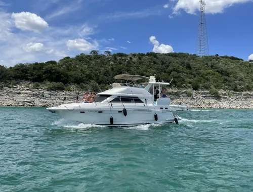 Yacht named Goldeneye taking a group of people celebrating a birthday party back to the dock at the end of charter